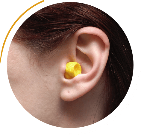 Woman with hearing protection in ear