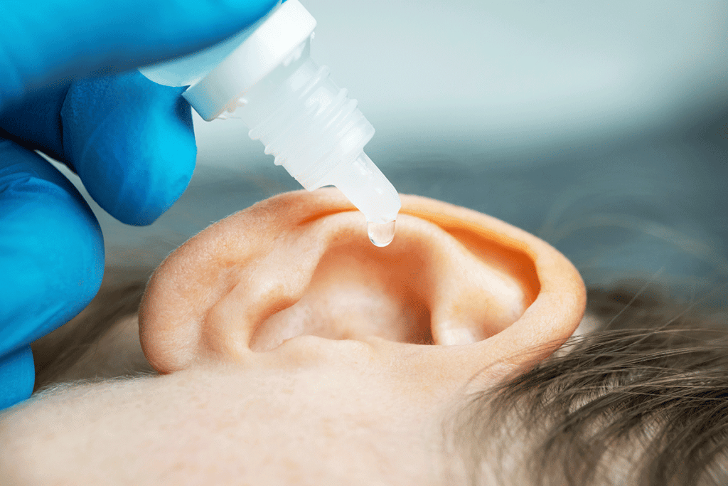 Child using peroxide to clean ear